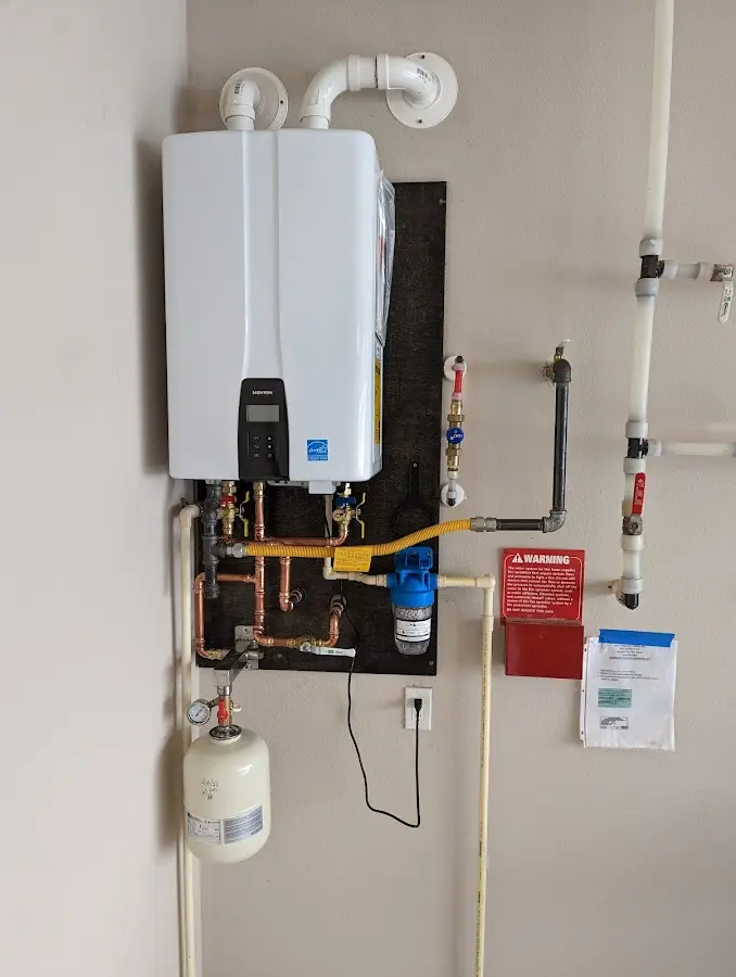 Professional plumber installing copper piping in a Loxahatchee Groves home